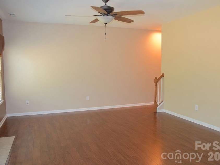 2007 Streamlet Way, Monroe, NC 28110.  MLS# CAR4376790, YatesRealty ID 23855. AI Staged Living Room