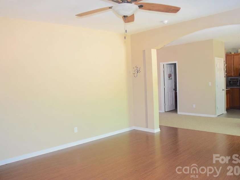 2007 Streamlet Way, Monroe, NC 28110.  MLS# CAR4376790, YatesRealty ID 23855. AI Staged Living Room
