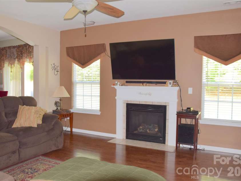 2007 Streamlet Way, Monroe, NC 28110.  MLS# CAR4376790, YatesRealty ID 23855. Living room with gas fireplace.