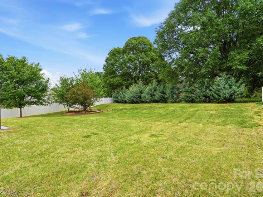 112 Meadow Stream Drive, Mount Holly, NC 28120.  MLS# CAR4378040, YatesRealty ID 23856. Backyard