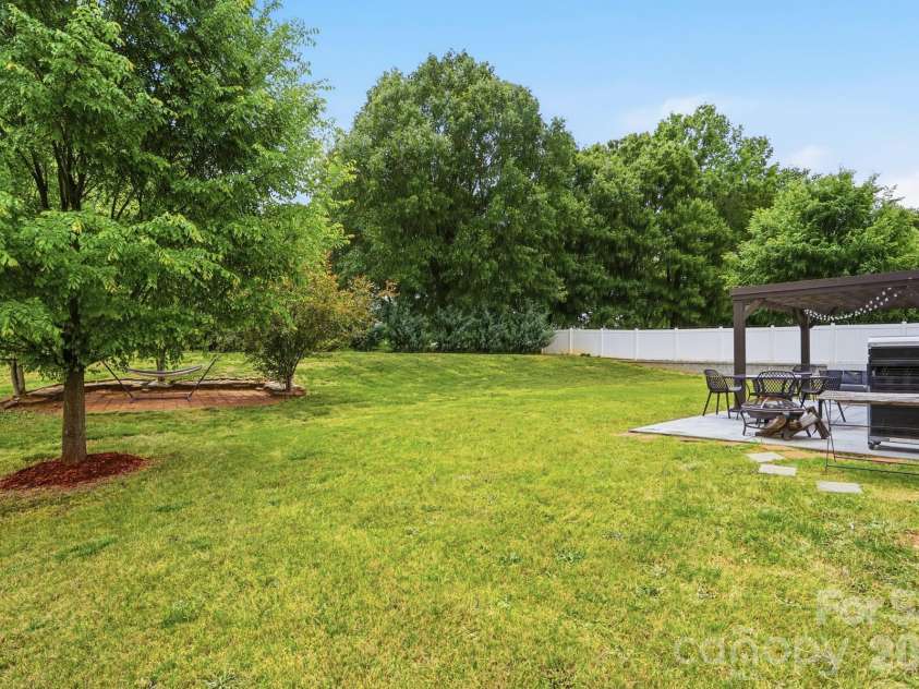 112 Meadow Stream Drive, Mount Holly, NC 28120.  MLS# CAR4378040, YatesRealty ID 23856. Backyard
