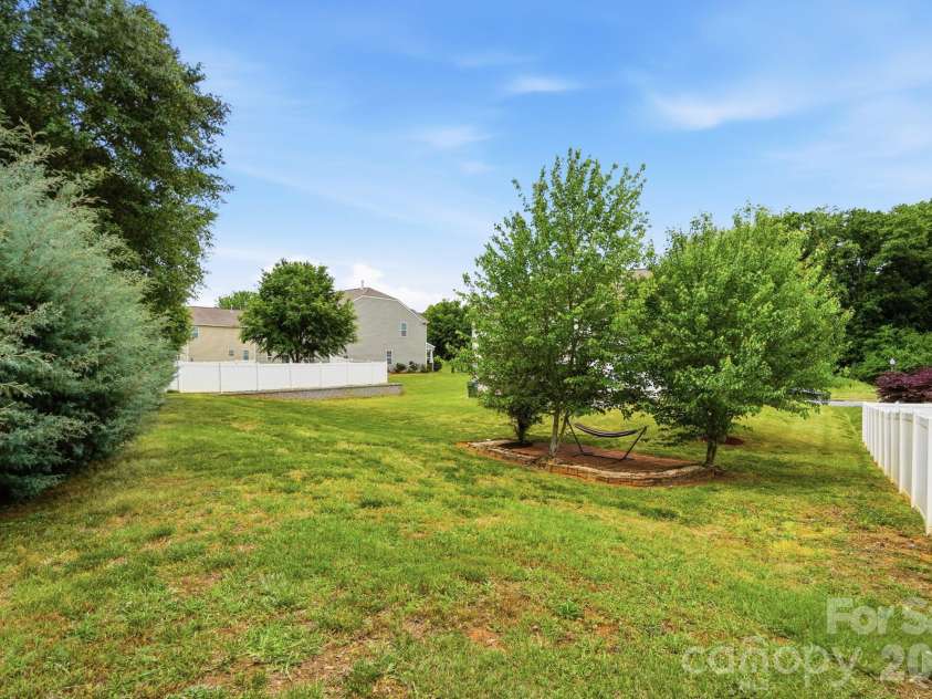 112 Meadow Stream Drive, Mount Holly, NC 28120.  MLS# CAR4378040, YatesRealty ID 23856. Backyard