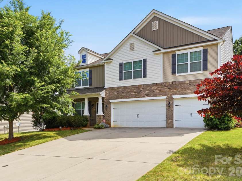 112 Meadow Stream Drive, Mount Holly, NC 28120.  MLS# CAR4378040, YatesRealty ID 23856. Front with a 3 car garage