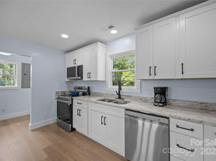 221 John C Logan Road, Rutherfordton, NC 28139.  MLS# CAR4273280, YatesRealty ID 23856. Laundry room off the kitchen