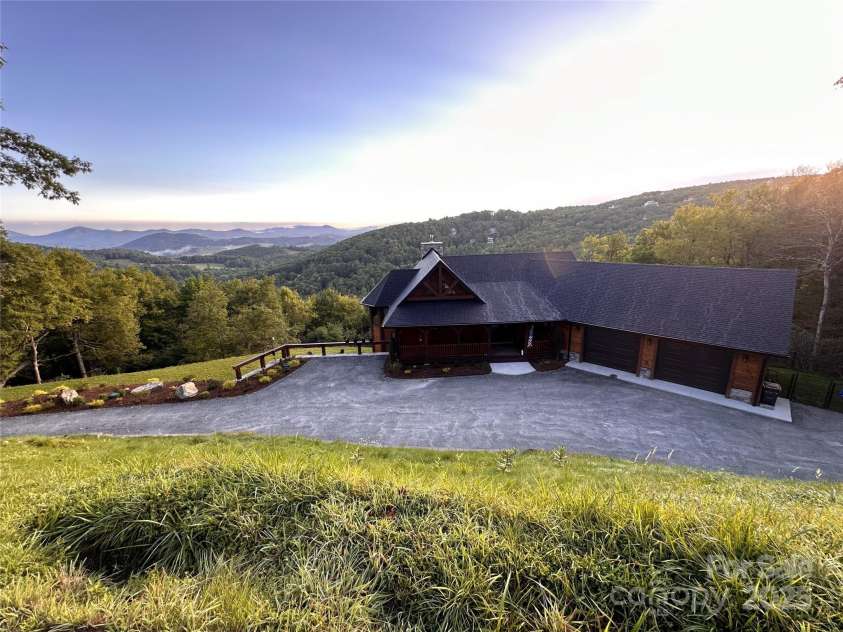 419 Antler Trail, Boone, NC 28607.  MLS# CAR4214579, YatesRealty ID 2386. Summer view of home & mountains!