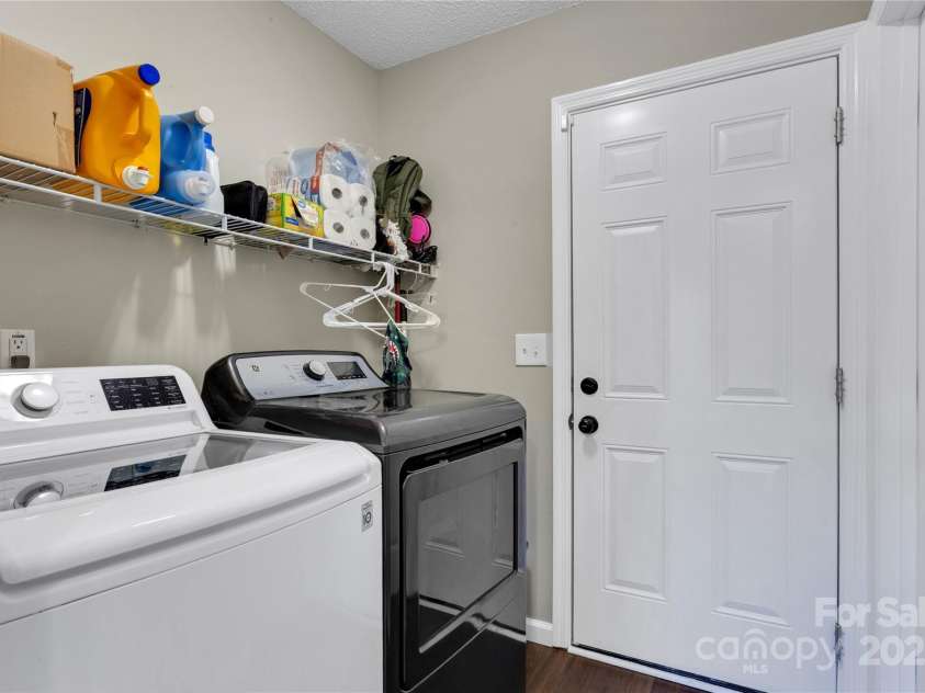 7 Diamond Hill Court, Greer, SC 29651.  MLS# CAR4317117, YatesRealty ID 2386. Laundry nook across from the 1/2 bath and right before the garage. 