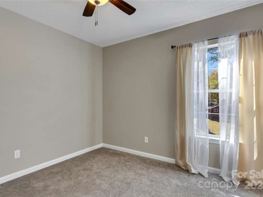 7 Diamond Hill Court, Greer, SC 29651.  MLS# CAR4317117, YatesRealty ID 2386. Secondary bedroom looking into your huge backyard