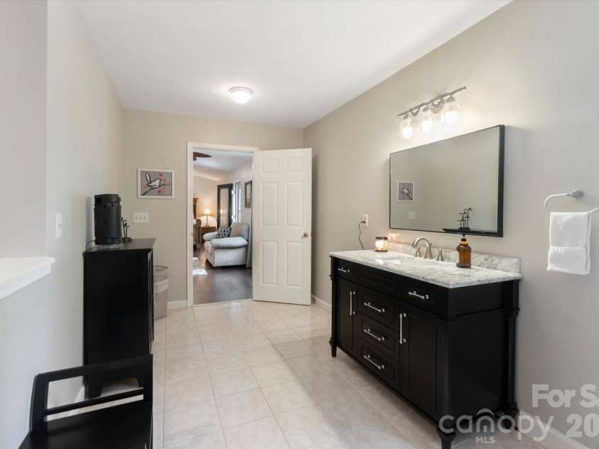 3860 Landrum Road, Columbus, NC 28722.  MLS# CAR4380844, YatesRealty ID 23865. Primary bath with tile floors.
