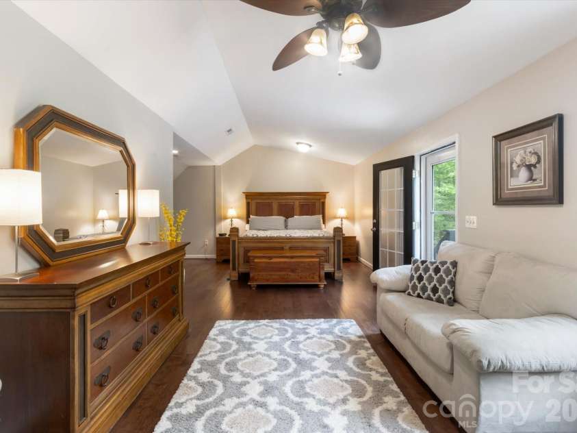 3860 Landrum Road, Columbus, NC 28722.  MLS# CAR4380844, YatesRealty ID 23865. Primary bedroom is plenty big.  On the right is the balcony door and access to back yard.