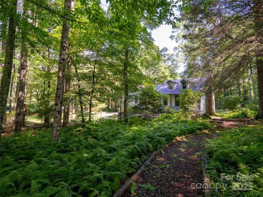 30 Falcon Wood Way, Flat Rock, NC 28739.  MLS# CAR4273281, YatesRealty ID 23873. Nestled in the woods