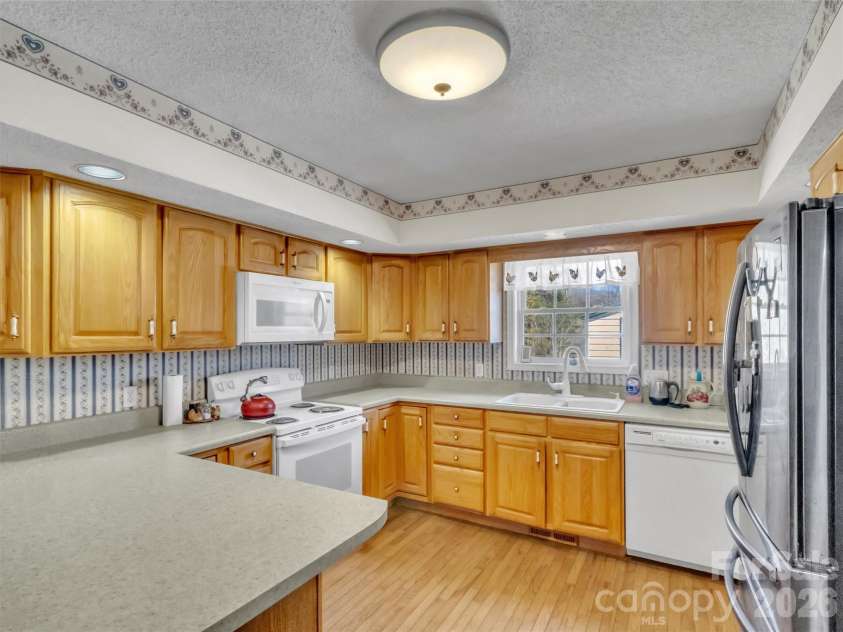 39 Millard Cove Road, Leicester, NC 28748.  MLS# CAR4355242, YatesRealty ID 23882. Kitchen with plenty of cabinets