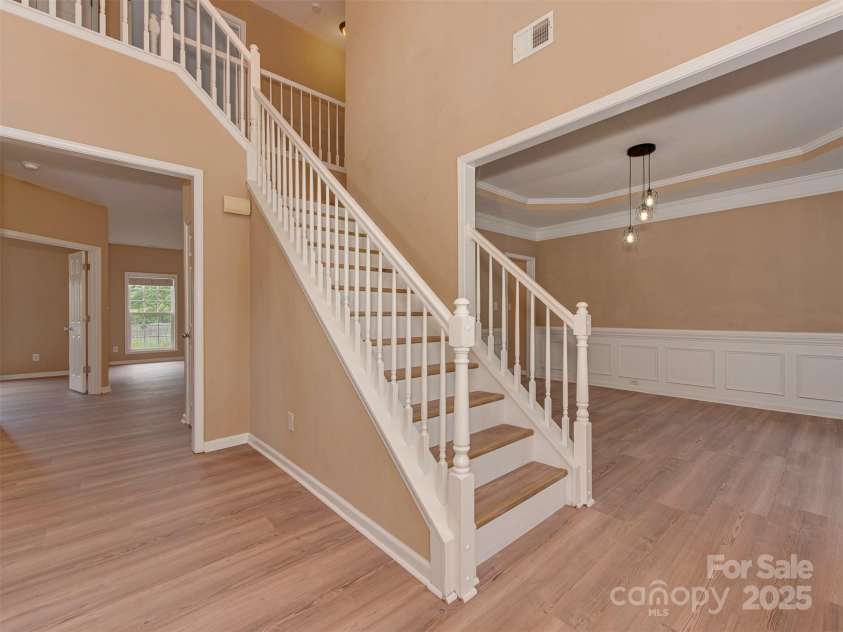 5607 Fulton Ridge Drive, Indian Trail, NC 28079.  MLS# CAR4259354, YatesRealty ID 23888. As you enter the home, you are welcomed by a 2 story high ceiling ! you can choose to go right to the dining room, up the stairs to the bedrooms, or straight to the great room (with the fireplace). If you take a