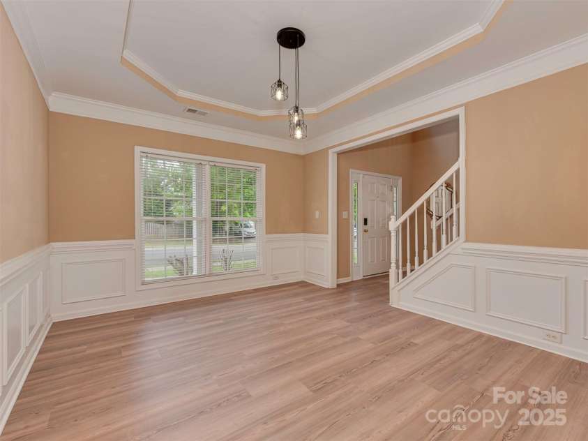 5607 Fulton Ridge Drive, Indian Trail, NC 28079.  MLS# CAR4259354, YatesRealty ID 23888. In here, we crossed the dining room and are looking back at the entrance. Did you know that the kitchen has an entrance behind where the cameraman is standing?