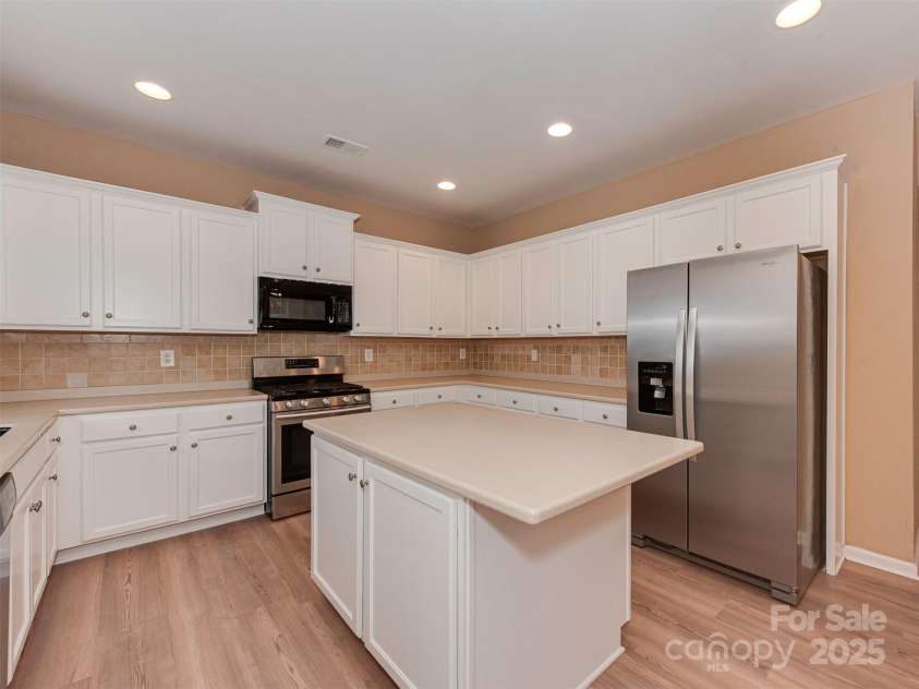 5607 Fulton Ridge Drive, Indian Trail, NC 28079.  MLS# CAR4259354, YatesRealty ID 23888. The kitchen is much bigger than in the picture however the cameraman wasn't able to capture the whole kitchen in one picture