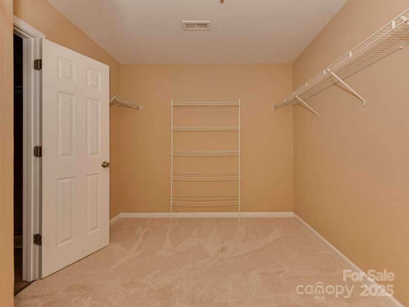 5607 Fulton Ridge Drive, Indian Trail, NC 28079.  MLS# CAR4259354, YatesRealty ID 23888. The owner's walk in closet looking from the right side towards the left side. it is indeed quite large !