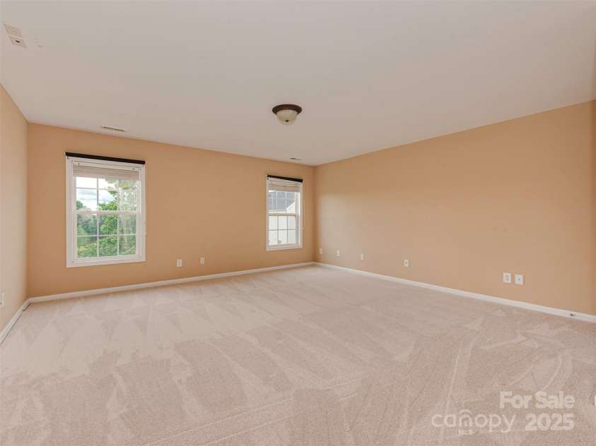5607 Fulton Ridge Drive, Indian Trail, NC 28079.  MLS# CAR4259354, YatesRealty ID 23888. This is the Bonus Room. it is HUGE !!! it is in the middle-back of the house. it overlooks the backyard. it has a closet too !