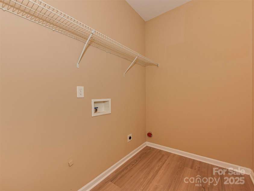 5607 Fulton Ridge Drive, Indian Trail, NC 28079.  MLS# CAR4259354, YatesRealty ID 23888. This is the Laundry Room. there is a small corridor before reaching the laundry room. There is a closet in that corridor too !