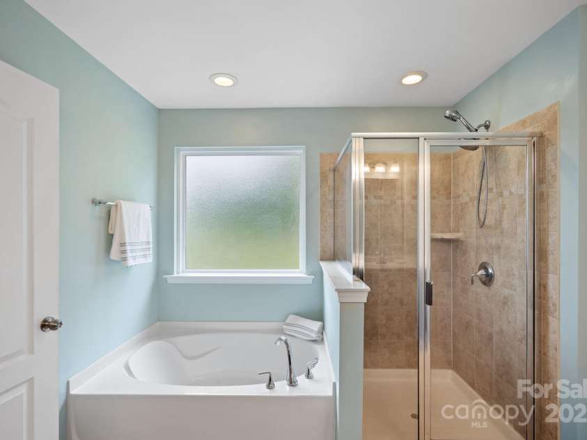 131 Cherry Bark Drive, Mooresville, NC 28117.  MLS# CAR4270193, YatesRealty ID 23893. Large Shower & Soaking Tub