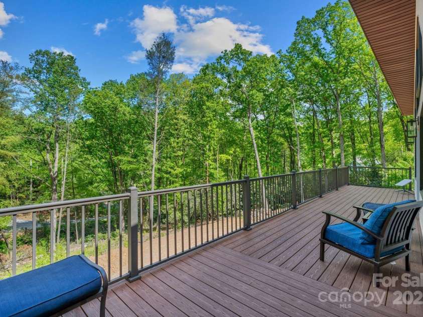 143 Burnside Trail, Hendersonville, NC 28792.  MLS# CAR4258291, YatesRealty ID 23895. Enjoy the expansive wraparound porch.