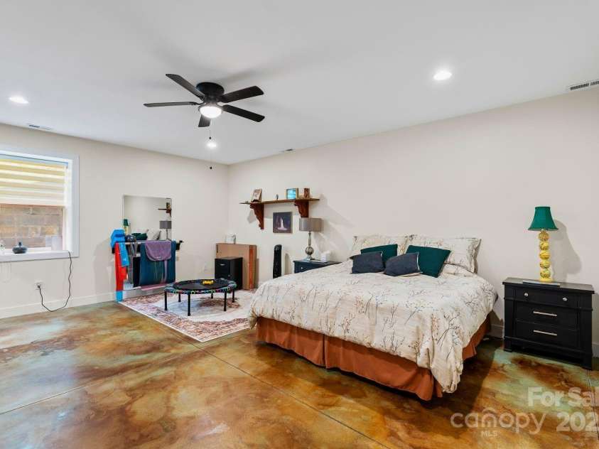 143 Burnside Trail, Hendersonville, NC 28792.  MLS# CAR4258291, YatesRealty ID 23895. Lower level ensuite bedroom.
