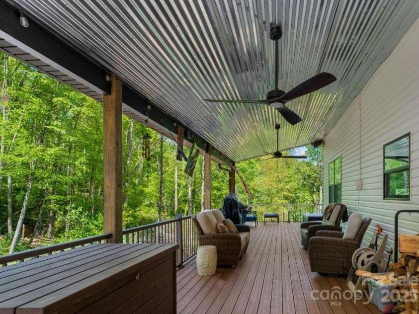 143 Burnside Trail, Hendersonville, NC 28792.  MLS# CAR4258291, YatesRealty ID 23895. Porch has metal roof, electric and gas feed on north side.