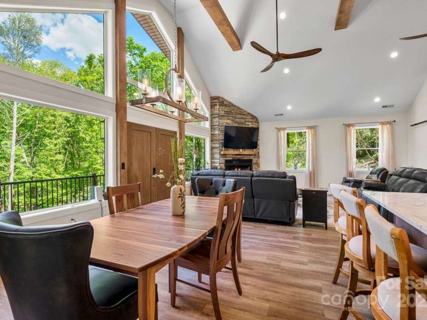 143 Burnside Trail, Hendersonville, NC 28792.  MLS# CAR4258291, YatesRealty ID 23895. Stunning windows (lots of natural light!), vaulted ceiling, upgraded light fixtures.