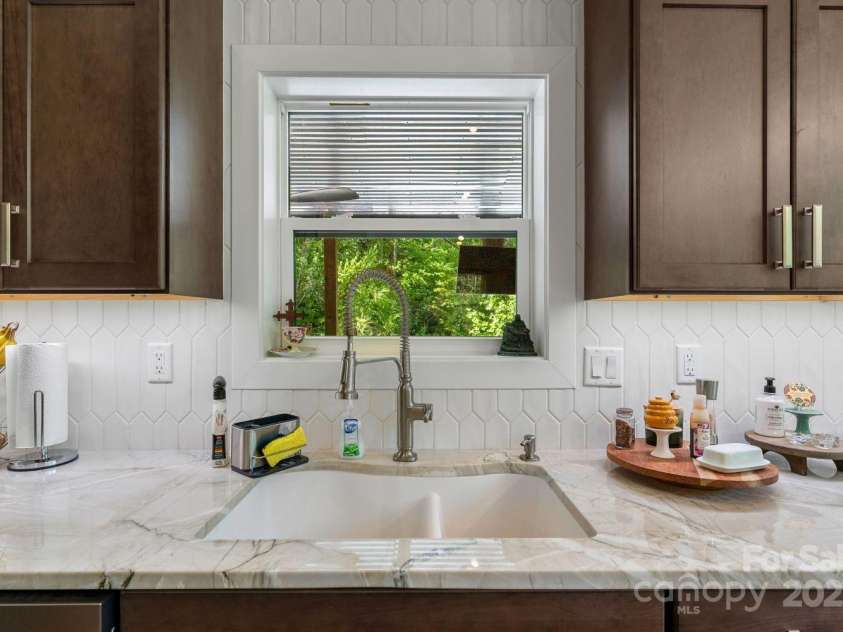 143 Burnside Trail, Hendersonville, NC 28792.  MLS# CAR4258291, YatesRealty ID 23895. Upgraded cabinetry, counters and sink.