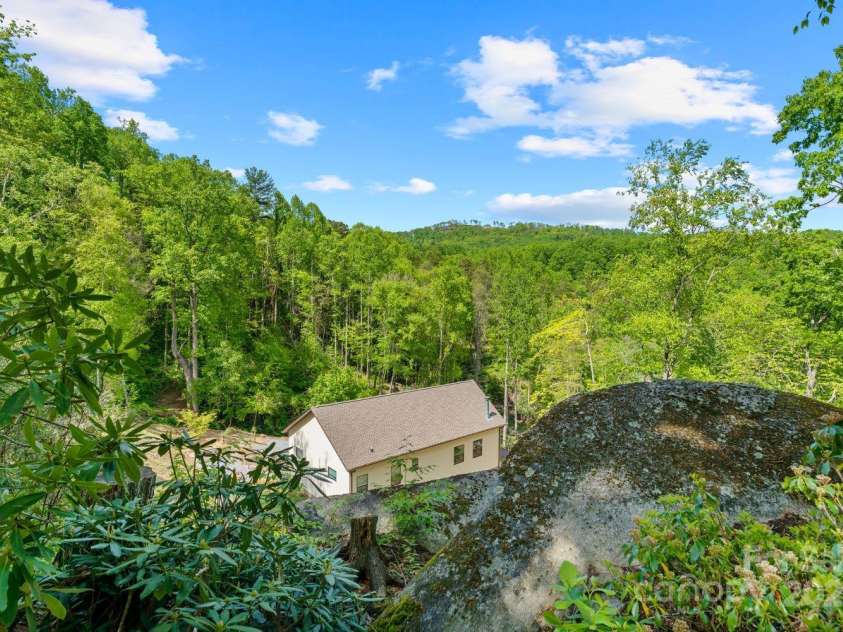 143 Burnside Trail, Hendersonville, NC 28792.  MLS# CAR4258291, YatesRealty ID 23895. View of house from on top of the boulders!