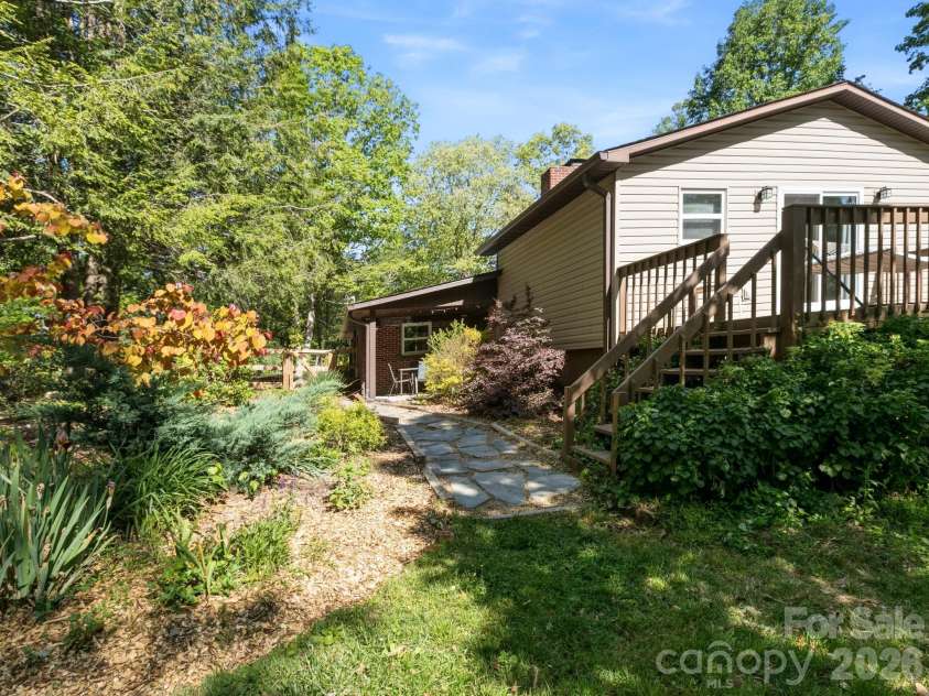 97 Columbia Circle, Hendersonville, NC 28792.  MLS# CAR4381538, YatesRealty ID 23914. Side Yard View
