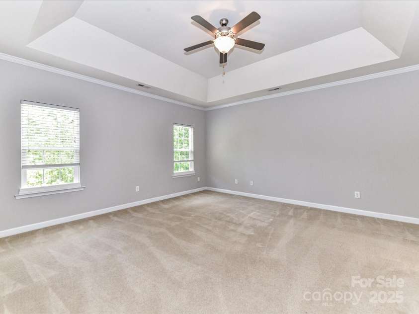 2369 Baxter Place, Concord, NC 28025.  MLS# CAR4251620, YatesRealty ID 23921. A Decorative Tray Ceiling in a huge Owner's Suite