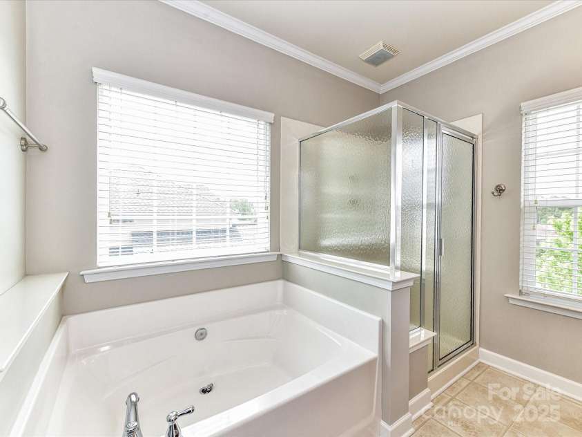 2369 Baxter Place, Concord, NC 28025.  MLS# CAR4251620, YatesRealty ID 23921. Soaking Tub and Step in Shower are featured