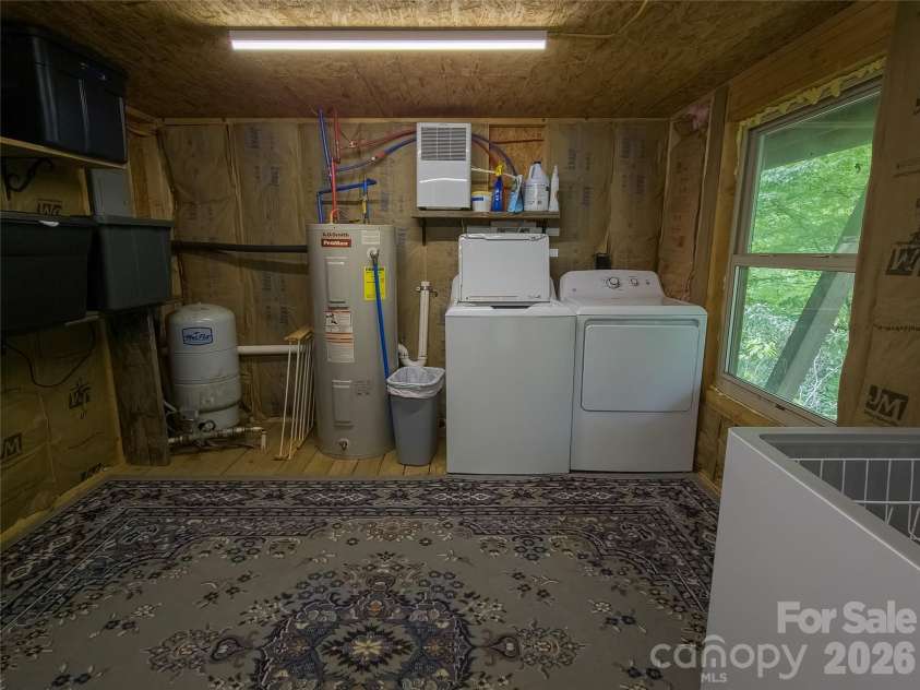 500 Winter Star Road, Burnsville, NC 28714.  MLS# CAR4382216, YatesRealty ID 23924. Lower level laundry & storage, flex space