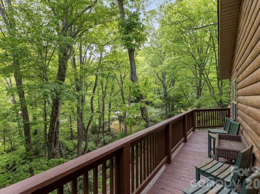 500 Winter Star Road, Burnsville, NC 28714.  MLS# CAR4382216, YatesRealty ID 23924. Wrap around deck at Cabin