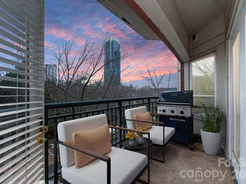 415 Church Street, Charlotte, NC 28202.  MLS# CAR4349165, YatesRealty ID 2393. Virtually staged to show furniture placement 