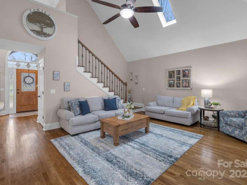 10032 Hunters Trace Drive, Concord, NC 28027.  MLS# CAR4235512, YatesRealty ID 23932. Gather with the ones you love in the spacious lving room