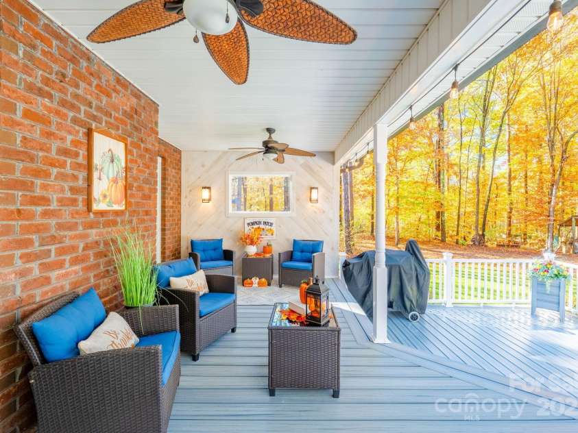 10032 Hunters Trace Drive, Concord, NC 28027.  MLS# CAR4235512, YatesRealty ID 23932. The covered deck gives you a perfect spot to beat the heat and enjoy the great outdoors