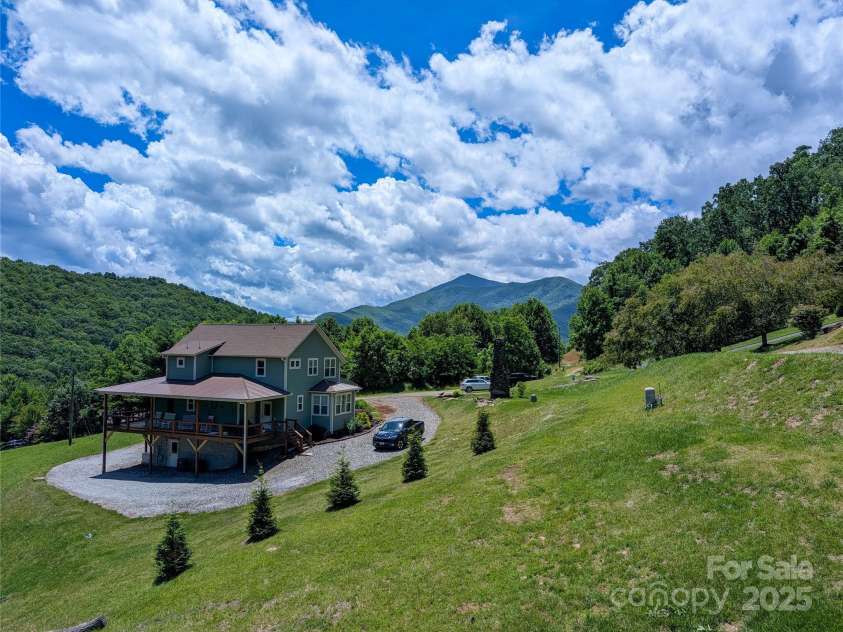 338 Majestic Mountain Drive, Burnsville, NC 28714.  MLS# CAR4277521, YatesRealty ID 2394. Additional mountain view from front side covered porch