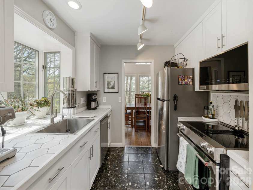 403 Cherokee Road, Asheville, NC 28804.  MLS# CAR4367190, YatesRealty ID 23941. Efficient Kitchen with Marble Floor Tile