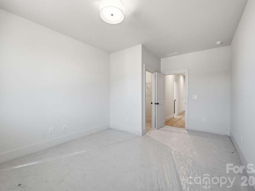 7245 Westrow Avenue, Charlotte, NC 28278.  MLS# CAR4314661, YatesRealty ID 2395. Bedroom #3 features a spacious walk-in closet and natural light from the window overlooking the front of the home. 