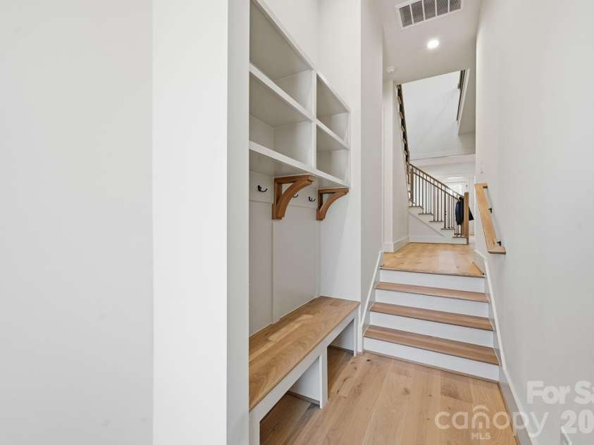 7245 Westrow Avenue, Charlotte, NC 28278.  MLS# CAR4314661, YatesRealty ID 2395. Charming drop zone at the garage entry featuring a built-in bench seat and cubbies. Perfect for storage. 