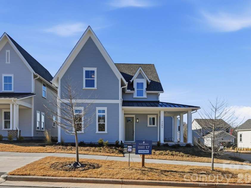 7245 Westrow Avenue, Charlotte, NC 28278.  MLS# CAR4314661, YatesRealty ID 2395. Charming farm house with wrap around porch and primary suite on the main level.