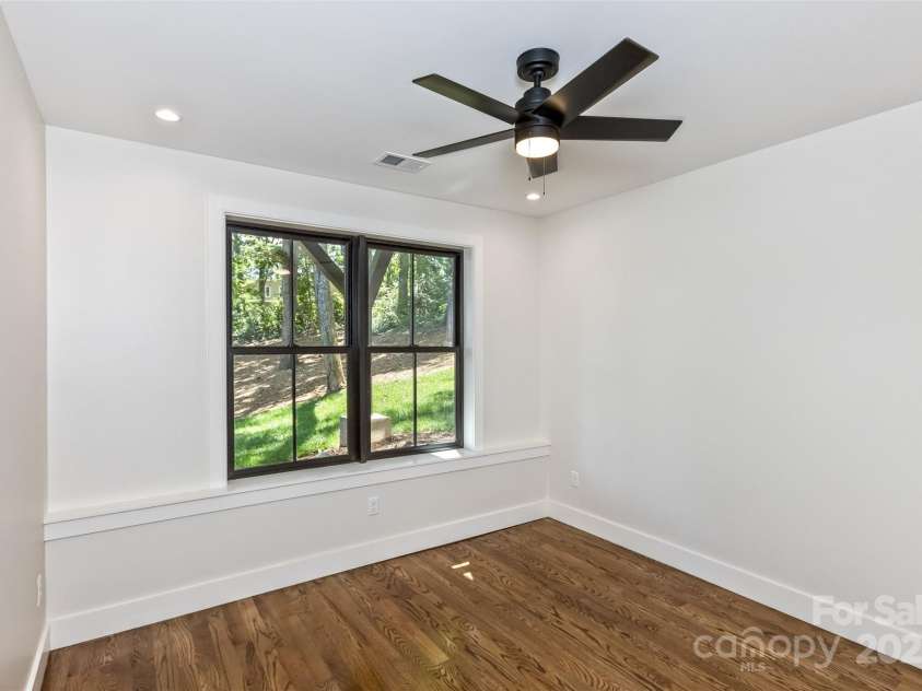 120 Gashes Creek Road, Asheville, NC 28805.  MLS# CAR4273637, YatesRealty ID 23957. Lower Level Bedroom 1