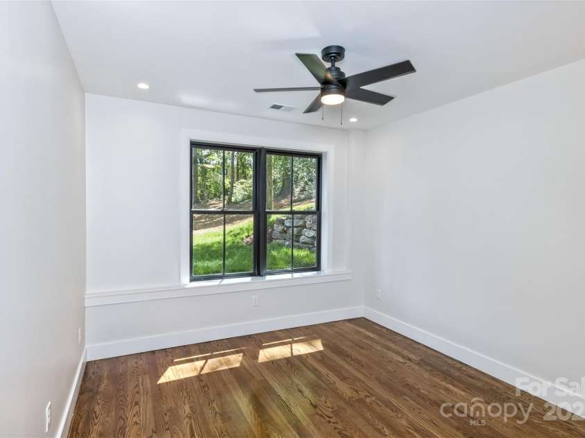 120 Gashes Creek Road, Asheville, NC 28805.  MLS# CAR4273637, YatesRealty ID 23957. Lower Level Bedroom 2