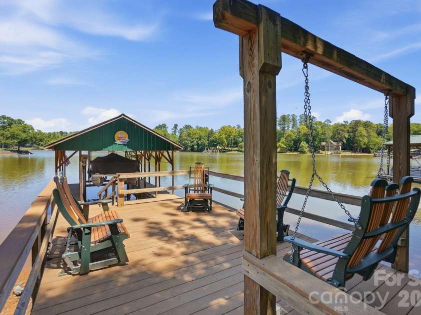 932 Thorn Ridge Lane, Clover, SC 29710.  MLS# CAR4346991, YatesRealty ID 23957. Lake side deck, covered dock with lift