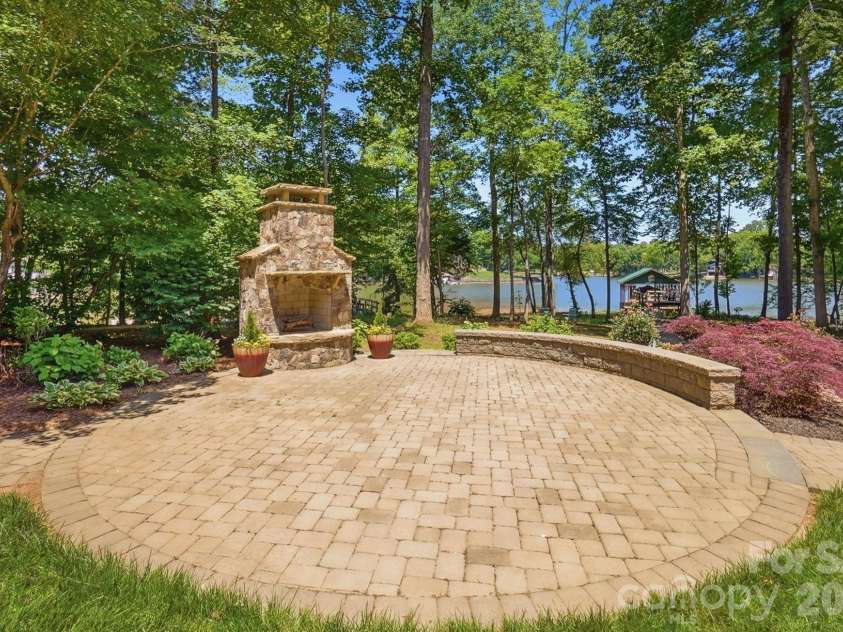 932 Thorn Ridge Lane, Clover, SC 29710.  MLS# CAR4346991, YatesRealty ID 23957. Outdoor fireplace, perfect for cool evenings