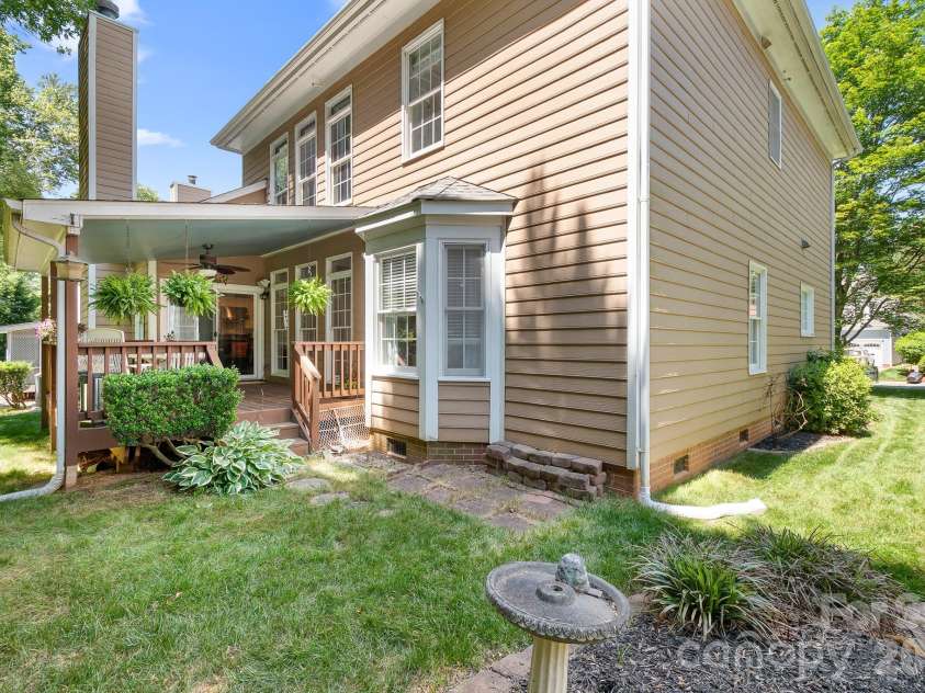 19914 Scanmar Lane, Cornelius, NC 28031.  MLS# CAR4373850, YatesRealty ID 23967. Covered back deck perfect for sipping on an ice cold drink this summer! Ceiling Fan and Gas Line too!
