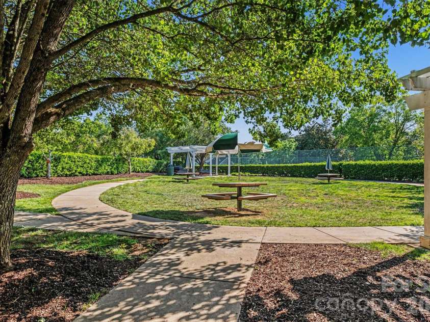 11945 Ridgeway Park Drive, Charlotte, NC 28277.  MLS# CAR4378177, YatesRealty ID 23973. Lush green common area