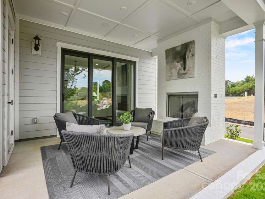 14011 Camden Close Circle, Huntersville, NC 28078.  MLS# CAR4271139, YatesRealty ID 23982. Covered porch with exterior gas fireplace