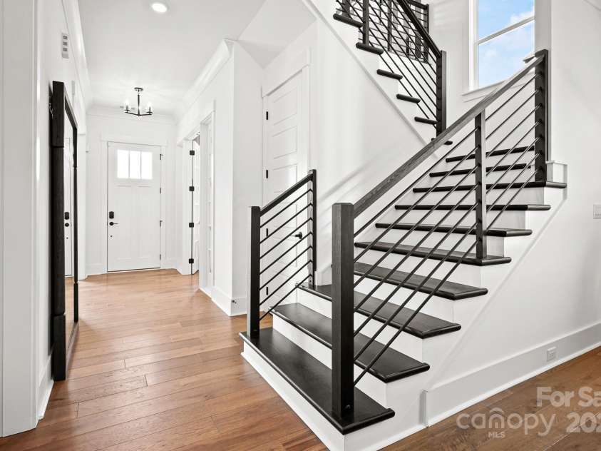 14011 Camden Close Circle, Huntersville, NC 28078.  MLS# CAR4271139, YatesRealty ID 23982. Open staircase with horizontal railing, and light filled landing