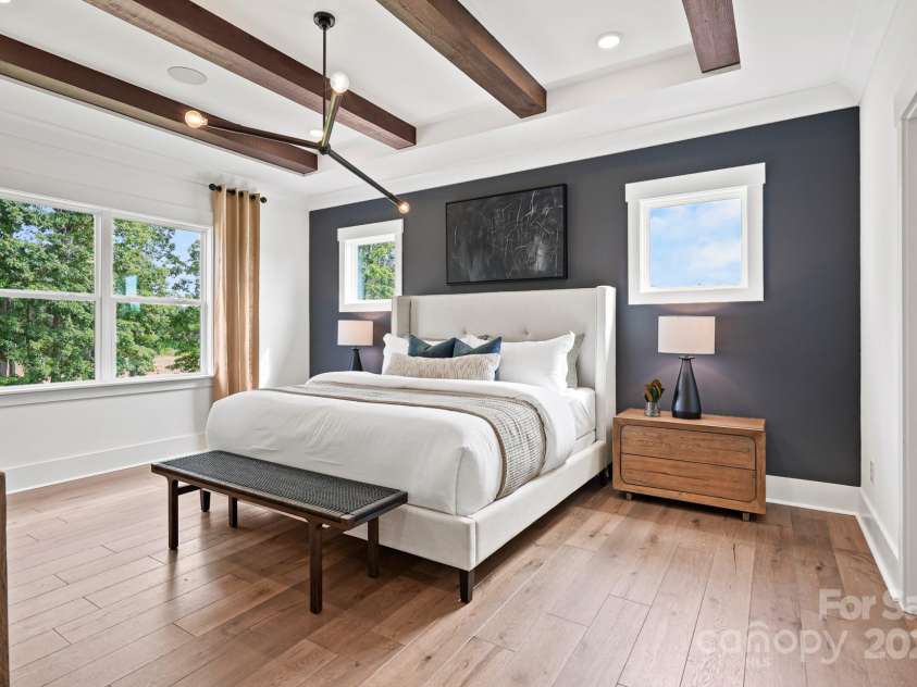 14011 Camden Close Circle, Huntersville, NC 28078.  MLS# CAR4271139, YatesRealty ID 23982. Secluded primary bedroom with beamed tray ceiling